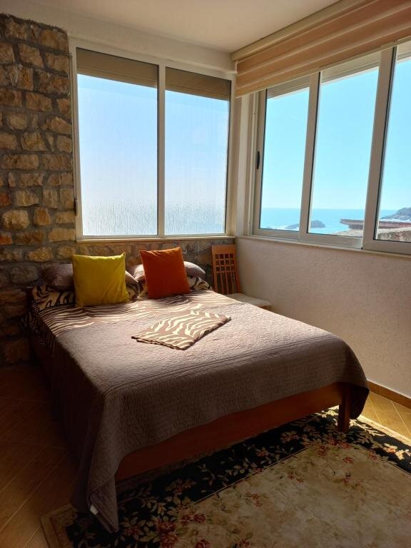 Bedroom with panoramic windows over the Adriatic