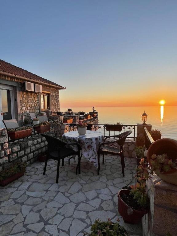 Rooftop terrace at dusk with sea view